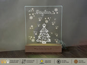 a glass block with a christmas tree on it