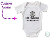 a baby bodysuit with a picture of a clock on it