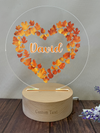 a heart shaped acrylic with the word david on it