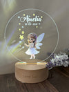 a personalized glass plaque with a fairy holding a wand