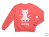 a pink sweatshirt with a white cat on it