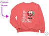 a pink sweatshirt with a santa clause on it