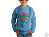 a young boy wearing a happy holidays sweatshirt