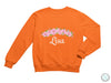 an orange sweatshirt with pink flowers on it