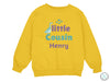 a yellow sweatshirt with the words little cousin henry printed on it