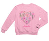 a pink sweatshirt with a heart and flowers on it